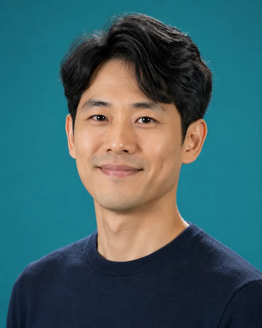 Headshot on a flat teal studio backdrop before the background is removed
